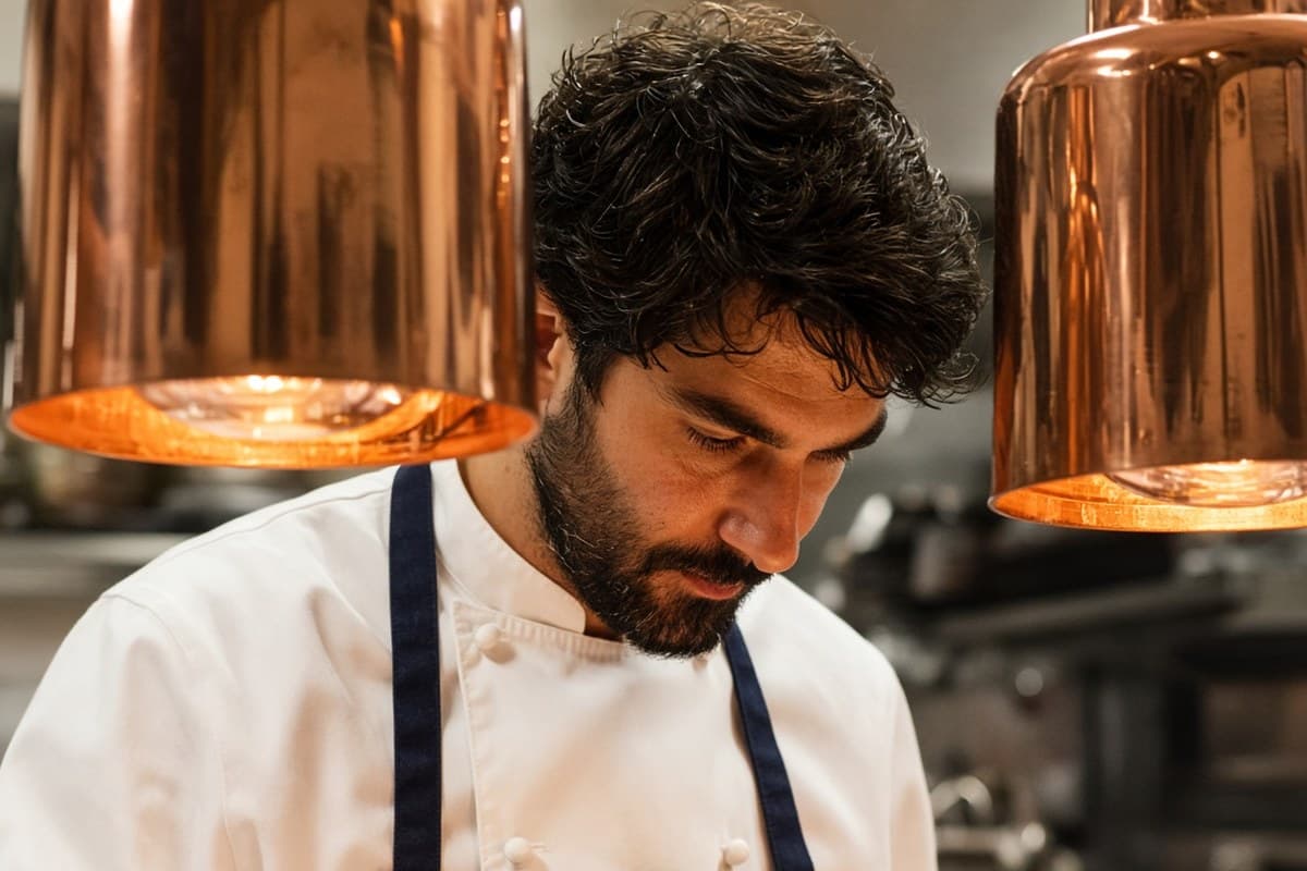 Chef under heat lamps on the line